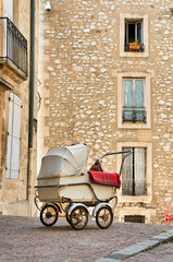 Fototapeta na wymiar Antique baby carriage in Montpellier France