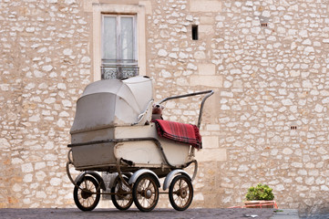 Fototapeta na wymiar Antique baby carriage in Montpellier France