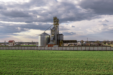 Obraz premium agro-processing and manufacturing plant for processing and silver silos for drying cleaning and storage of agricultural products, flour, cereals and grain. Granary elevator.