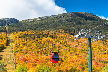 Cable car in a majetic mountain landscape on  sunny autumn day. Beautiful autumn colours. © alpegor