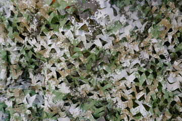 Camouflage net for hunting, military or sun protection.
Close up, texture, background
