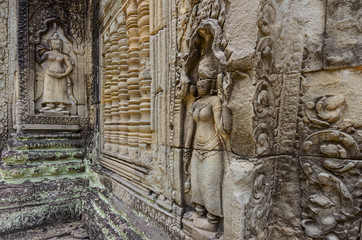 Apsara dancer stone sculpture from Hindu mythology, carved on Preah Khan "Tomb Raider" temple in Angkor Wat Unesco park, Siem Reap, Cambodia