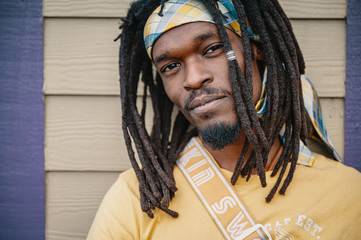 portrait of a young man with dreadlocks