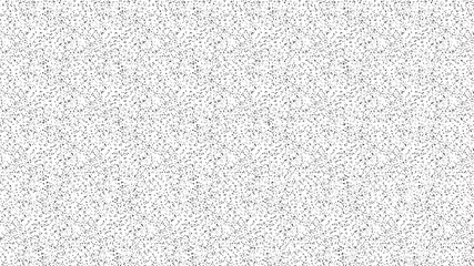 Speckled, grainy background in black and white. Monochrome stippled, mostly white with black speckles.