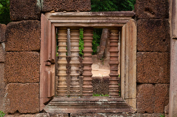 Ruin of column window, typical of the ancient Khmer temples of Angkor Wat, Siem Reap, Cambodia