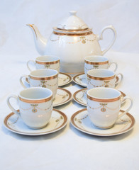 Mock up / design set of elegant and traditional teapot colorful white blue gold coffee cup & Tea cup on cup's plate beside the hot tea pot , design/ drink-ware isolated on white background