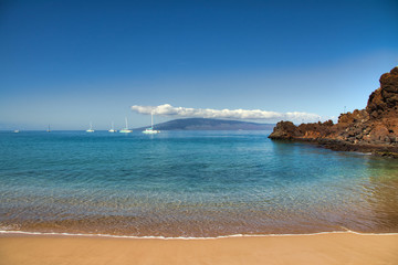 View of a sunny day at Black Rock at Ka'anapali Beach on Maui.