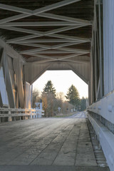 covered bridge on a summer evening