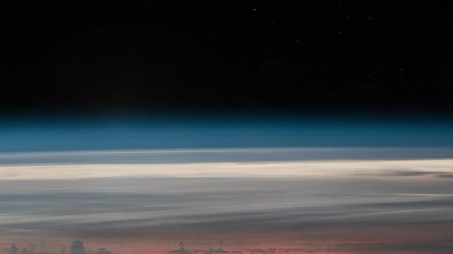 Scenic sunrise on cloudy earth horizon landscape view from space with sky stars  in background. Images furnished by Nasa