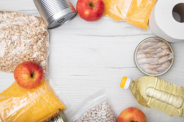 Donations food with canned food on light background background / canned goods and dry food non...