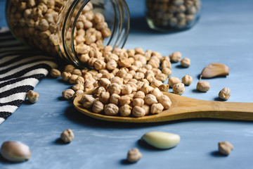 Raw chickpeas in a glass jar.