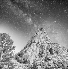 Sunset view of Devil's Tower and surrounding natural landscape