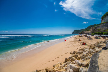 Bali, Indonesia - February, 2020: Amazing view on Melasti beach and blue sea water with white waves Bali, Indonesia.