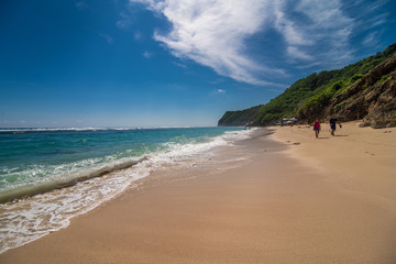 Bali, Indonesia - February, 2020: Amazing view on Melasti beach and blue sea water with white waves Bali, Indonesia.