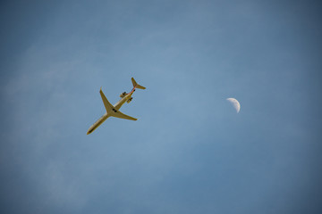 airplane in the sky with moon