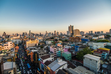 Fototapeta na wymiar Bangkok, Thailand - February 2020: Above view from rooftop on China town in the middle of city Bangkok, Thailand