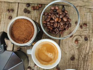 Cup and grain of coffee