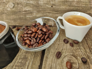 Cup and grain of coffee