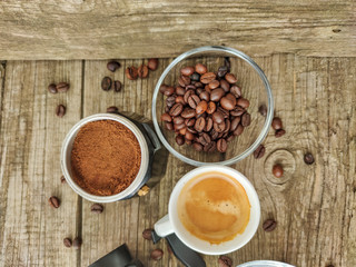 Cup and grain of coffee