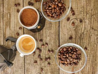 Cup and grain of coffee