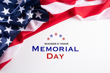Fototapeta na wymiar Happy Memorial Day. American flags with the text REMEMBER & HONOR against a white background. May 25.