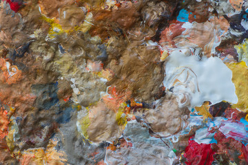 palette of mixed oil paint in many different colors