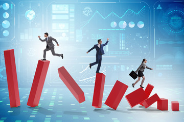 Business people in a collapsing economy concept