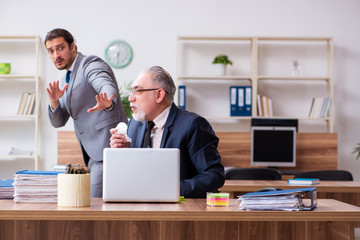 Two employees in pandemic concept at workplace