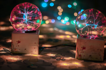 Overlay Fairy Lights Bokeh and plasma ball decoration season greeting theme new year party holiday festival.Selective focus