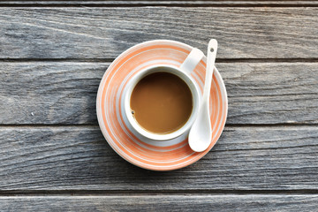 cup of coffee on wooden table