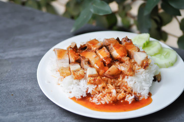 crispy pork with rice, rice topped with crispy pork and sauce