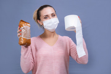 Woman in a mask with buckwheat and toilet paper