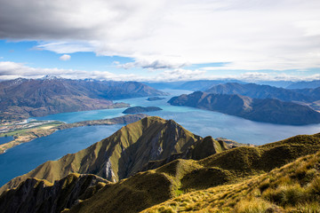 Roys peak mountain hike in Wanaka New Zealand. Popular tourism travel destination. Concept for hiking travel and adventure. New Zealand landscape background.	