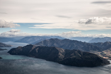 Fototapeta na wymiar New Zealand landscape background. Roys peak mountain hike in Wanaka New Zealand. Popular tourism travel destination. Hiking travel and adventure. 