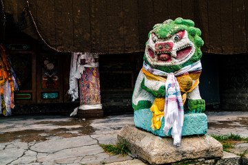 Fototapeta na wymiar Stone lion in Arou Grand Temple in Qinghai Province, China