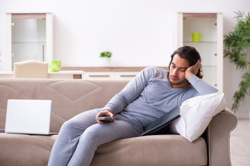 Fototapeta premium Young male employee freelancer working from home