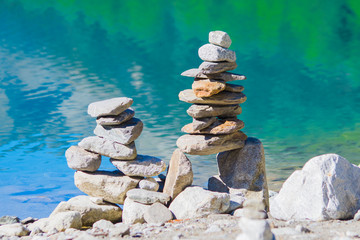 stone pyramids, little man, mound, ovoo, Inukshuk made near the lake or the mountain river
