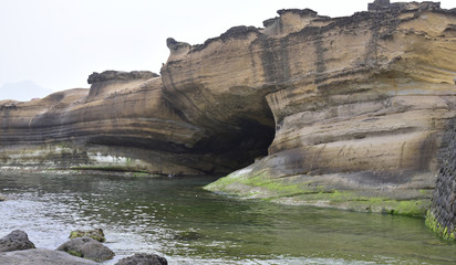 North Taiwan coastline rock sculpture and cave created from  ocean wave erosion.  