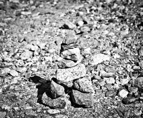 stone pyramids, little man, mound, ovoo, Inukshuk in black and white