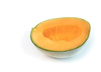 Cantaloupe melon cut in half with seeds scooped out. Also known as rockmelon, sweet melon or spanspek (Cucumis melo). Orange sweet flesh, netted rind. Isolated on white.