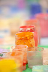 glass jars with colored water for painting