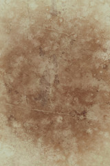 Old brown paper background design with distressed vintage stains and paint spatter and grungy faded shabby center, elegant antique beige color borders