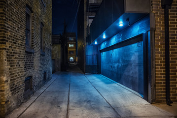Dark and eerie urban city alley at night 