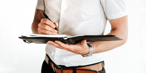 Man holding a planner