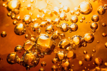 abstract water with  bubbles soars over a golden background