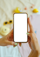 Blank mobile screen with woman hands and pastel colourful background