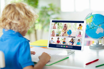 Online remote learning. School kids with computer.