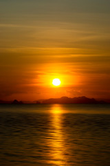Sunset sky and soft cloud above the lake in golden time.