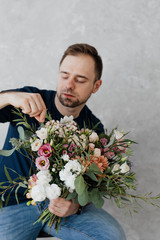 Man arranging flowers