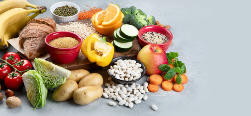 Foods high in carbohydrates on grey background